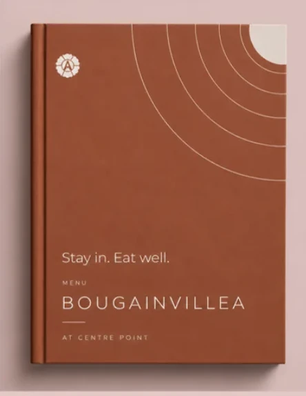 The Bougainvillea at Centre Point menu in Oxidised Clay, with white arcs and the lotus