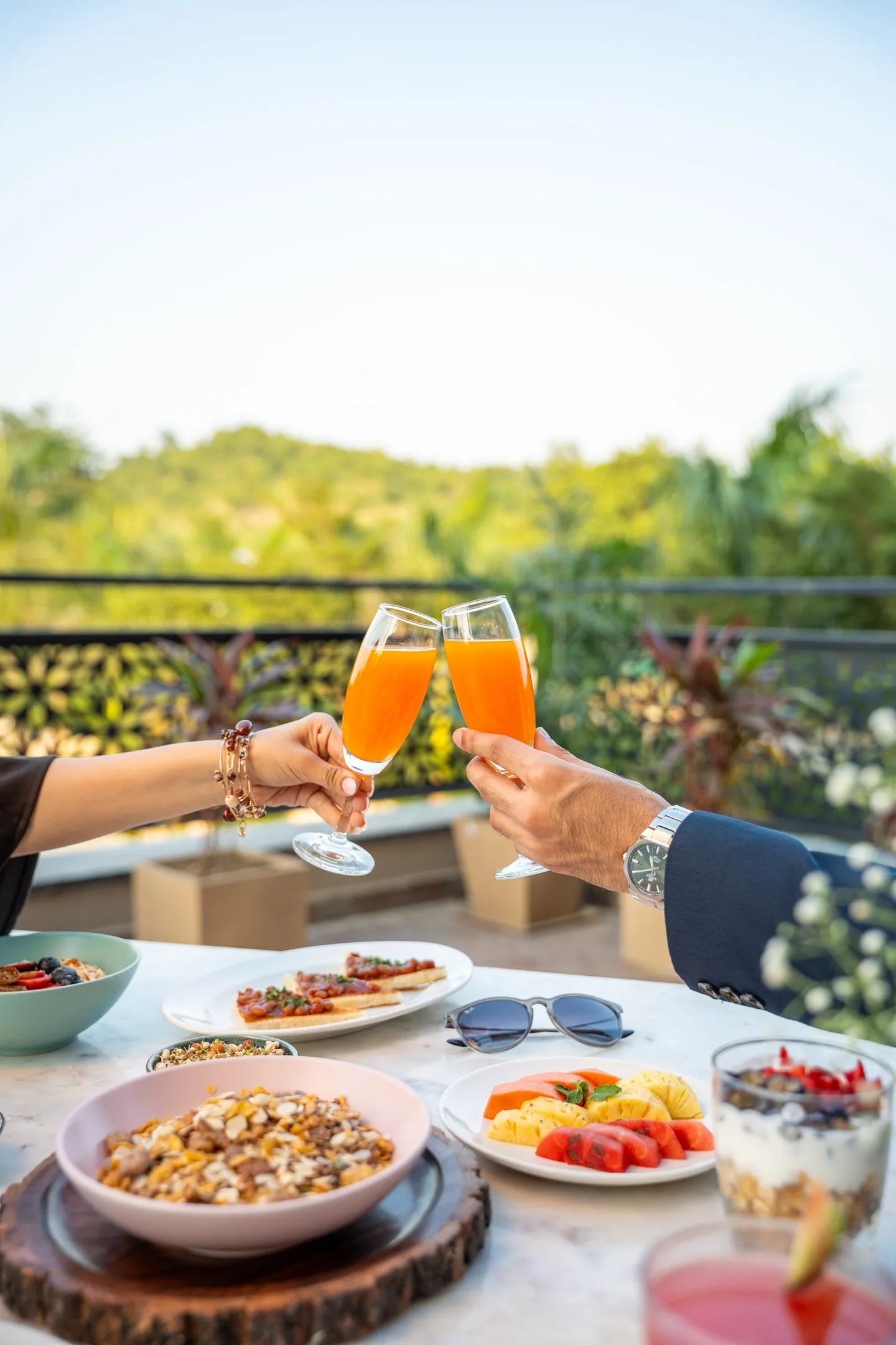 Breakfast and drinks on the Bougainvillea terrace, with hills behind