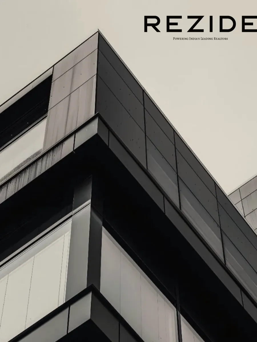 Black-and-white Rezide residential tower seen from below